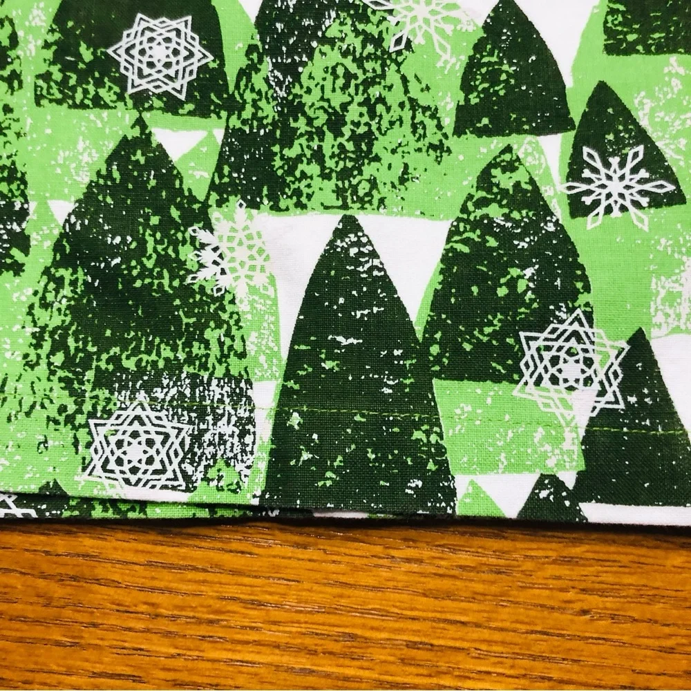 Crate & Barrel Snowy Forest, Shades of green on white Table Runner, 24”x90”.